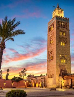 Koutoubia mosque in the morning surrounded by palm tree, Marrakesh, Morocco